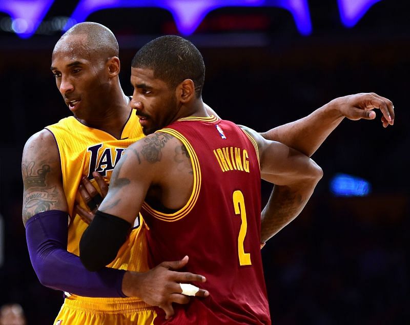 Kyrie Irving (right) with Kobe Bryant (left) during a Cleveland Cavaliers v Los Angeles Lakers 2016 game