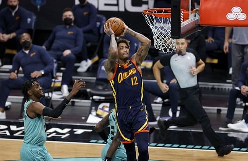 Kelly Oubre Jr. #12 attempts a dunk against the Charlotte Hornets