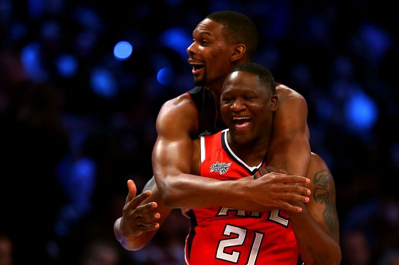 Chris Bosh (#1) celebrates with NBA Legend Dominique Wilkins after winning the Degree Shooting Stars Competition.