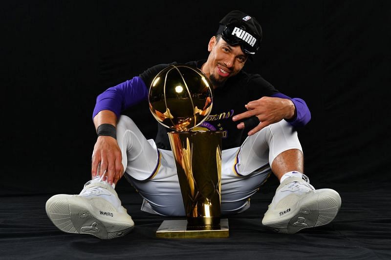 Danny Green poses with the Larry O&#039;Brien Trophy after winning the 2020 NBA Finals with LA Lakers [Image: Jesse D. Garrabrant/NBAE ]