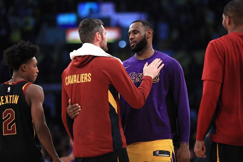 Kevin Love (#0) of the Cleveland Cavaliers hugs LeBron James (#23) of the LA Lakers.