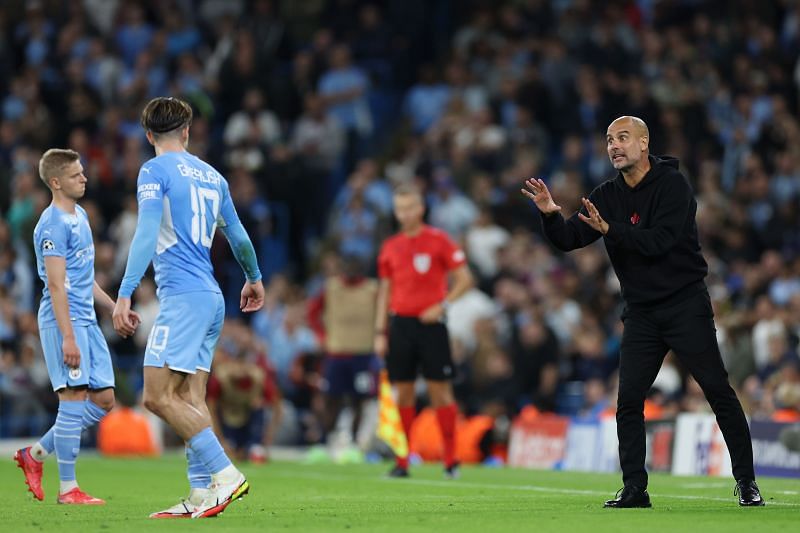 Pep Guardiola (right) recorded a milestone win on the night.