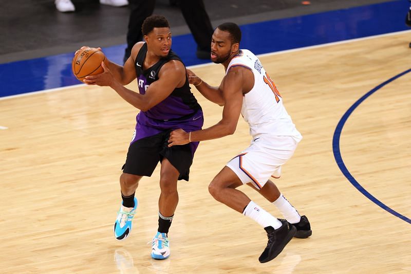 Kyle Lowry #7 of the Toronto Raptors in action against Alec Burks #18 of the New York Knicks during their game at Madison Square Garden on April 11, 2021 in New York City.