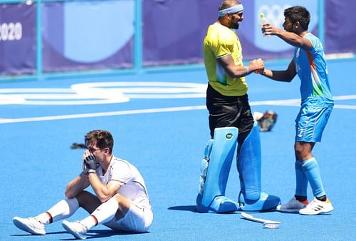 India's Varun Kumar (right) and PR Sreejesh celebrate after India won the bronze medal at the Olympics.