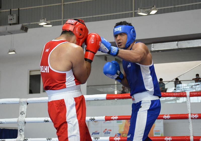 SSCB&#039;s Sanjeet (in blue) in action during 92kg semi-final at the National Boxing Championships.