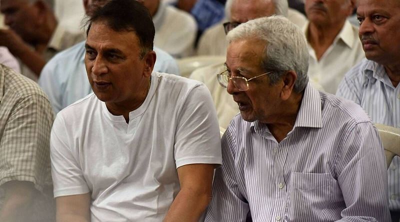 Vasudev Paranjape, seen here sitting next to Sunil Gavaskar, passed away at the age of 82
