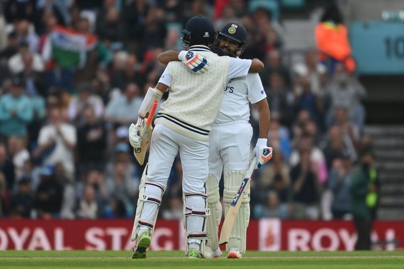 Cheteshwar Pujara (L) and Rohit Sharma built a solid partnership before getting out in the same over
