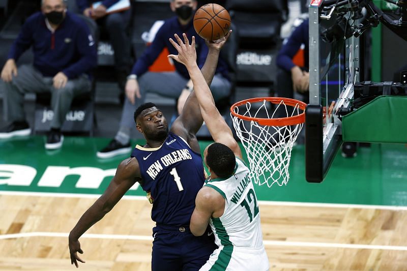 New Orleans Pelicans forward Zion Williamson #1 dunking on Celtics player