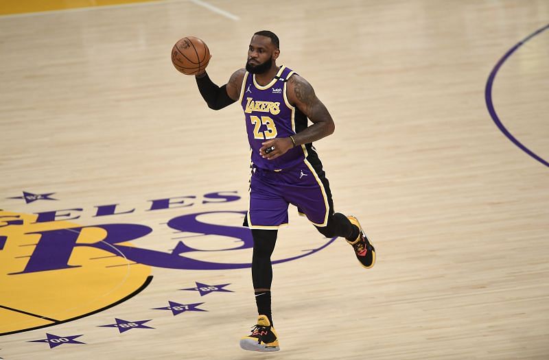 LOS ANGELES, CA - APRIL 30: LeBron James #23 of the Los Angeles Lakers dribbles the ball after returning to the starting lineup against the Sacramento Kings at Staples Center on April 30, 2021 in Los Angeles, California.