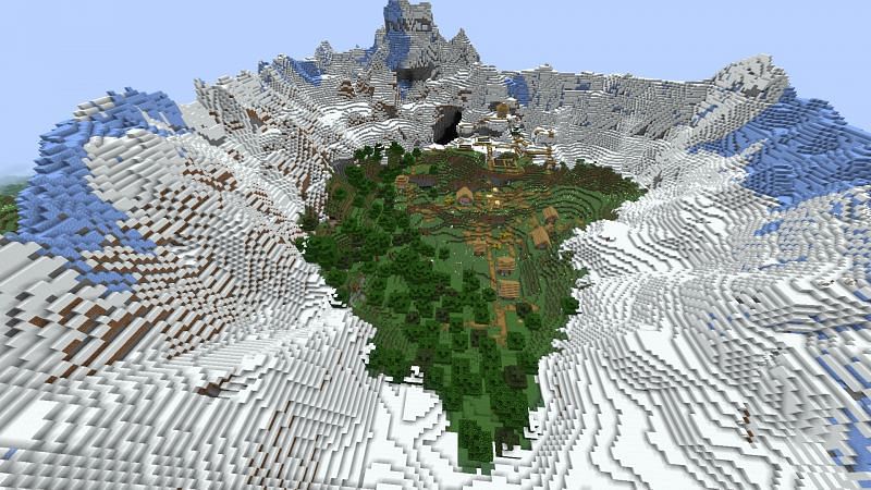 Village surrounded by snow mountains (Image via Minecraft)