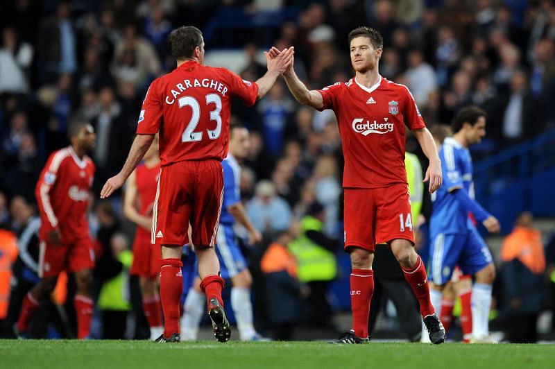 Xabi Alonso (right) with Jamie Carragher (left)