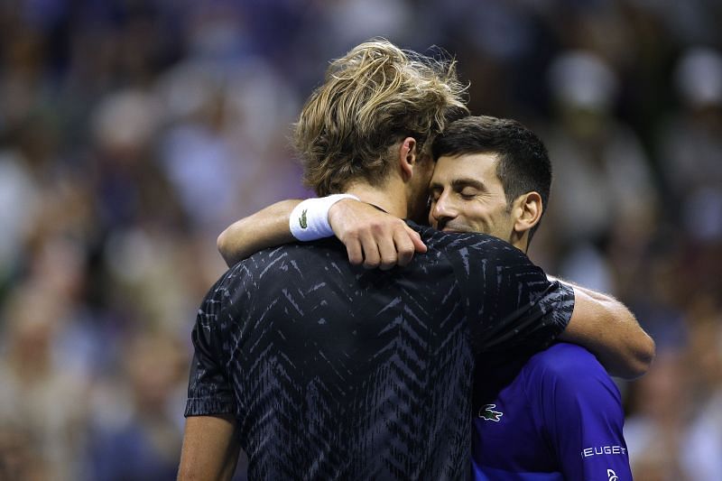 Alexander Zverev and Novak Djokovic hug after the match