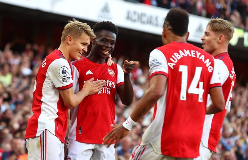 Arsenal players celebrate during their match against Tottenham Hotspur.