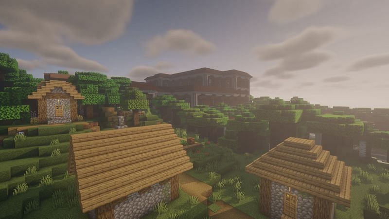 Woodland mansion and a village (Image via Minecraft)