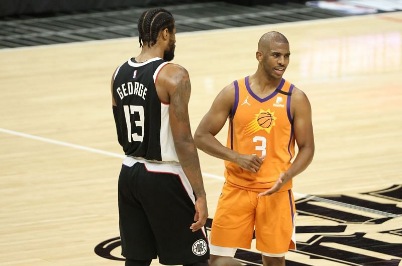 Chris Paul #3 of the Phoenix Suns argues a Suns foul with Paul George #13 of the LA Clippers during the second half of game three of the Western Conference Finals at Staples Center on June 24, 2021 in Los Angeles, California.