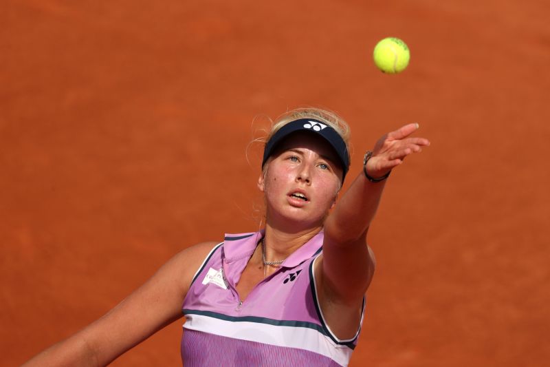 Clara Tauson serves during the 2021 French Open