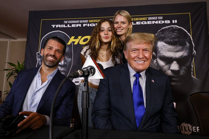 Former US President Donald Trump and Donald Trump Jr. (left) pose for a photo prior to the fight between Evander Holyfield and Vitor Belfort