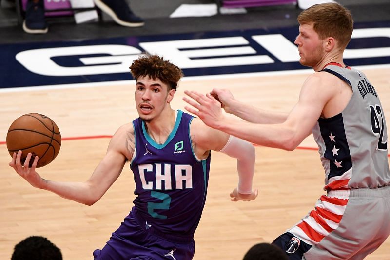 LaMelo Ball #2 of the Charlotte Hornets looks to shoot in front of Davis Bertans #42 of the Washington Wizards during the second half at Capital One Arena on May 16, 2021 in Washington, DC.