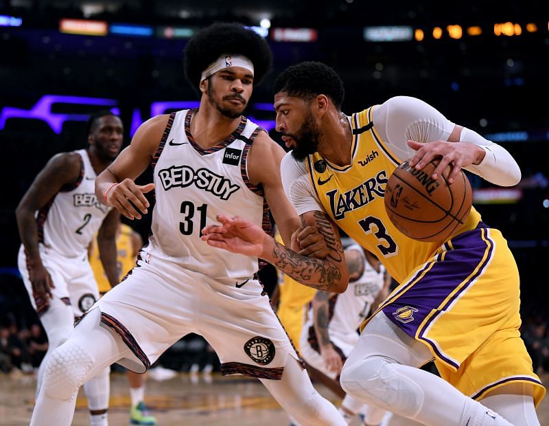 Anthony Davis (#3) of the LA Lakers drives to the basket on Jarrett Allen (#31) of the Brooklyn Nets.