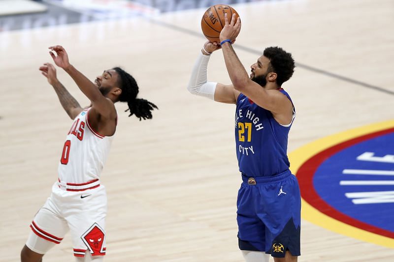Jamal Murray shoots over Coby White