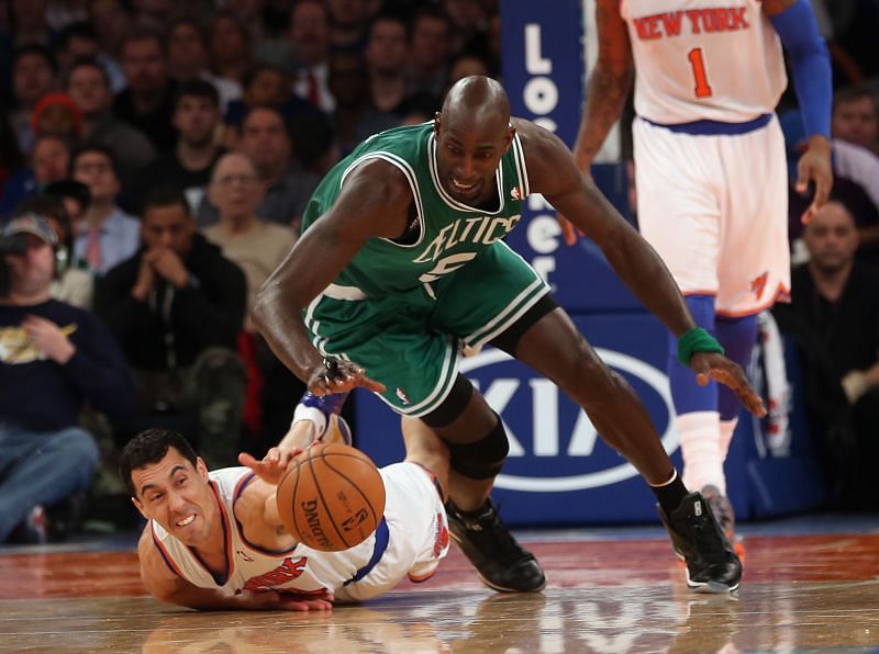 Pablo Prigioni #9 of the New York Knicks and Kevin Garnett #5 of the Boston Celtics struggle for a loose ball