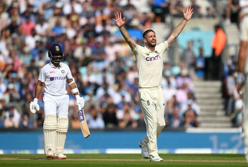 Chris Woakes (right) appeals successfully for the wicket of Ajinkya Rahane (background)