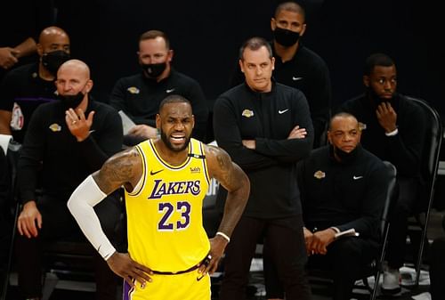 LeBron James #23 of the Los Angeles Lakers reacts ahead of assistant coach Jason Kidd and head coach Frank Vogel during the second half of Game Two of the Western Conference first-round playoff series at Phoenix Suns Arena on May 25, 2021 in Phoenix, Arizona.