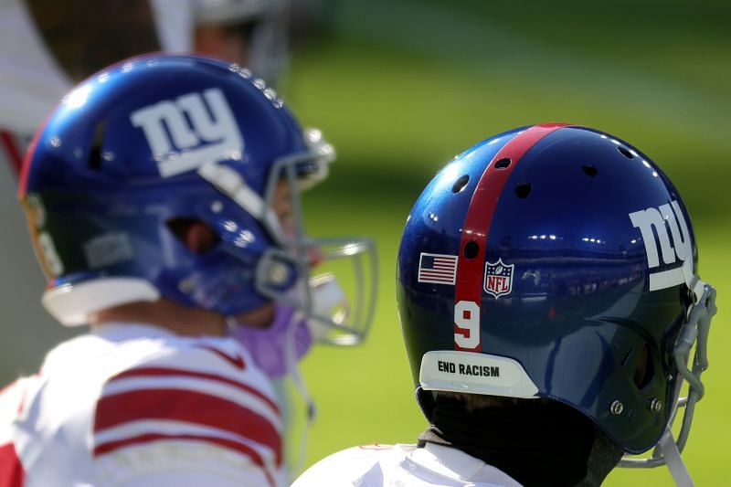 Punter Riley Dixon #9 of the New York Giants wears a &quot;End Racism&quot; sticker on the back of his helmet