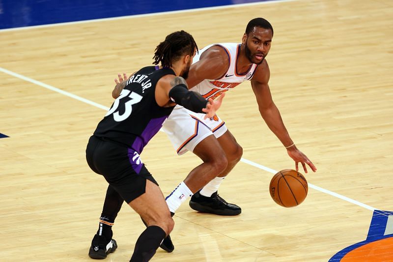 Alec Burks #18 of the New York Knicks in action against Gary Trent Jr. #33 of the Toronto Raptors