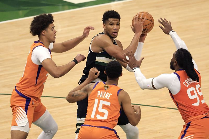 Giannis Antetokounmpo looks to pass the ball during a 2021 NBA Finals game.