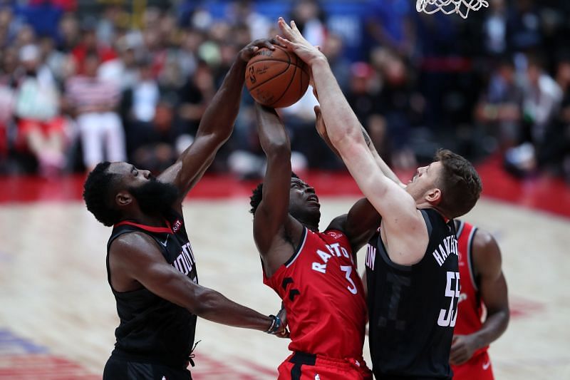 Isaiah Hartenstein (right) blocks a shot attempt.