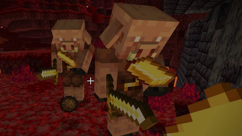 Piglin mobs holding golden swords (Image via Minecraft)