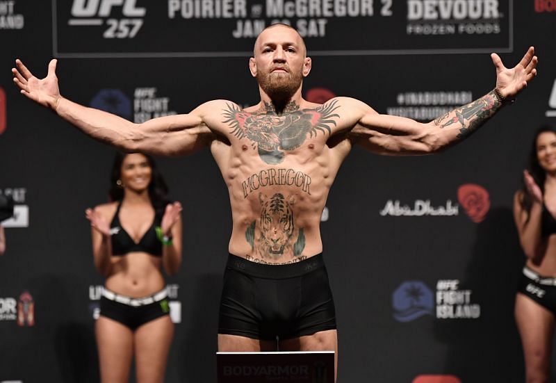 Conor McGregor weighing in for a fight in the lightweight division.