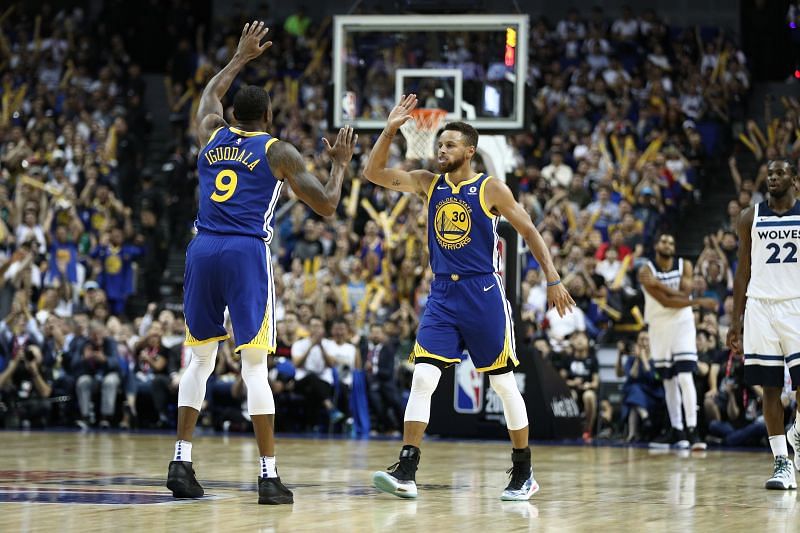 Andre Iguodala (left) celebrates with Stephen Curry (right)