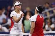 Elise Mertens (L) & Ons Jabeur shake hands after their match at the 2021 US Open