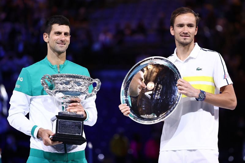 Novak Djokovic and Daniil Medvedev with their respective Australian Open trophies
