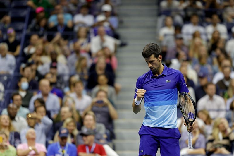 Novak Djokovic celebrates a point The Battle of the Surfaces- Rafael Nadal v Roger Federer