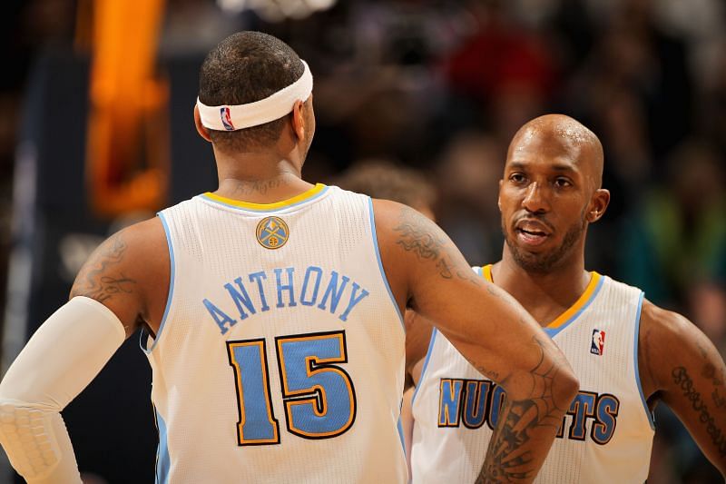 Carmelo Anthony in discussion with teammate Chauncey Billups