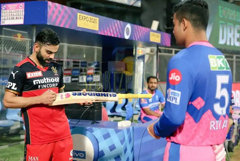Virat Kohli signs Riyan Parag's bat in IPL 2021