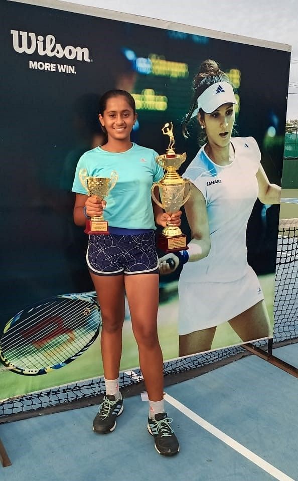 Sejal Bhutada with her singles and doubles trophies in Hyderabad