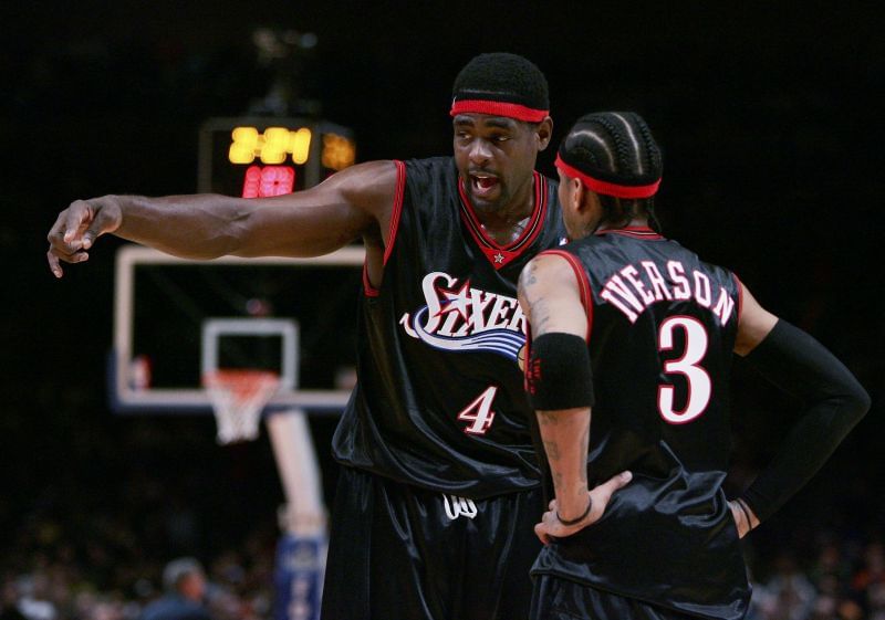 Chris Webber #4 talks with Allen Iverson.