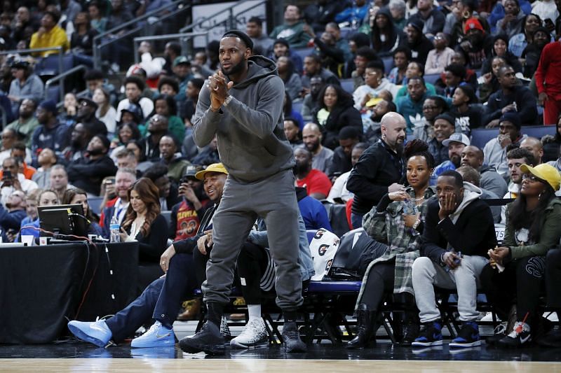 LeBron James of the Los Angeles Lakers reacts while watching son Bronny play with Sierra Canyon High School