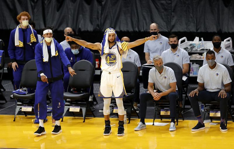 Stephen Curry and the Golden State Warriors celebrate their victory against the Denver Nuggets.