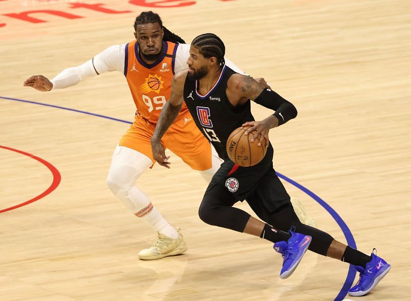 Paul George drives against Jae Crowder of the Phoenix Suns.