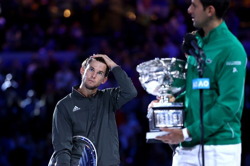 Thiem (L) and Djokovic at the 2020 Australian Open trophy presentation ceremony.