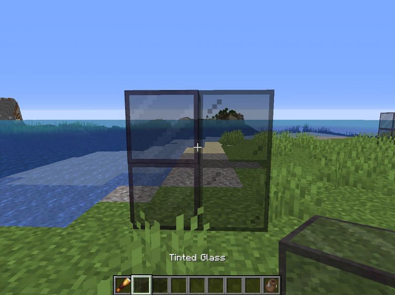 Tinted glass is a new light-blocking form of glass introduced in Minecraft&#039;s Caves &amp; Cliffs update (Image via Mojang)