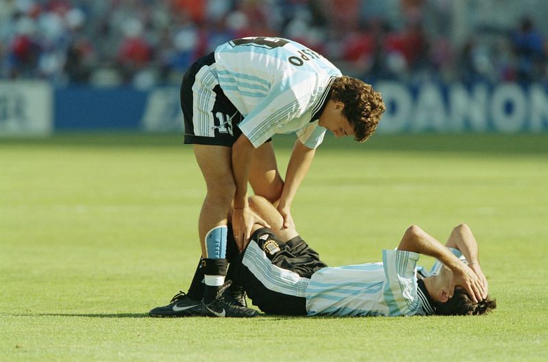 Hernan Crespo of Argentina consoles team mate Roberto Ayala after a 2-1 defeat in the 1998 World Cup quarter-final against Holland. Credit: Ben Radford /Allsport