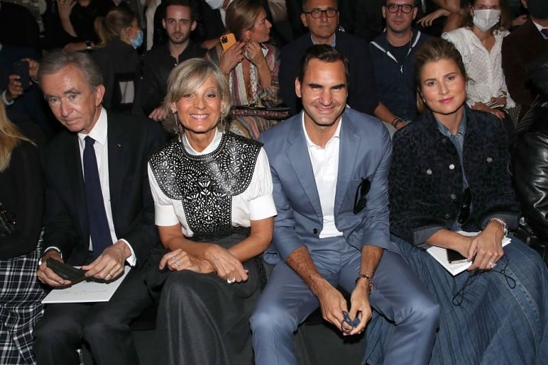 Roger Federer and wife Mirka seated to watch Dior's show