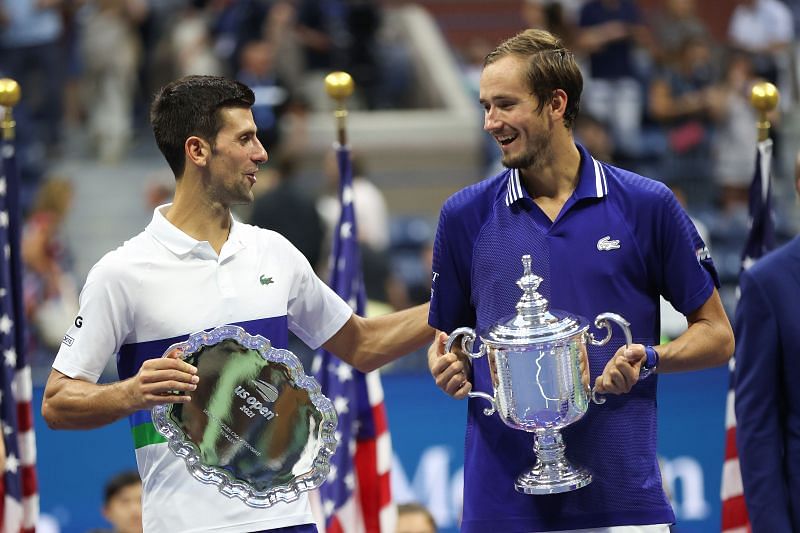 Novak Djokovic and Daniil Medvedev with their respective trophies