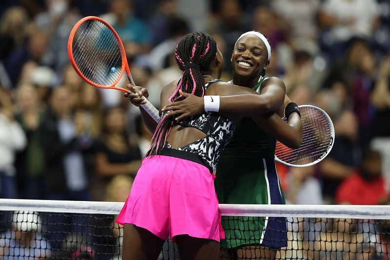 Coco Gauff (L) &amp; Sloane Stephens embrace at the net at the 2021 US Open